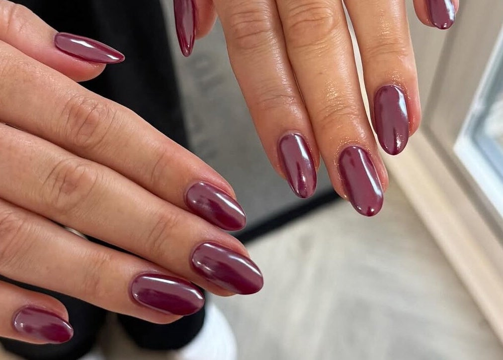 Stylish burgundy manicure from LCBeauty, Swindon, England, GB, showcasing elegant nail art.