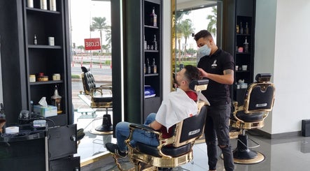 Hair stylist at Stile Di Capelli Gents Salon, Dubai, Dubai, AE, grooming a client in a chic interior.