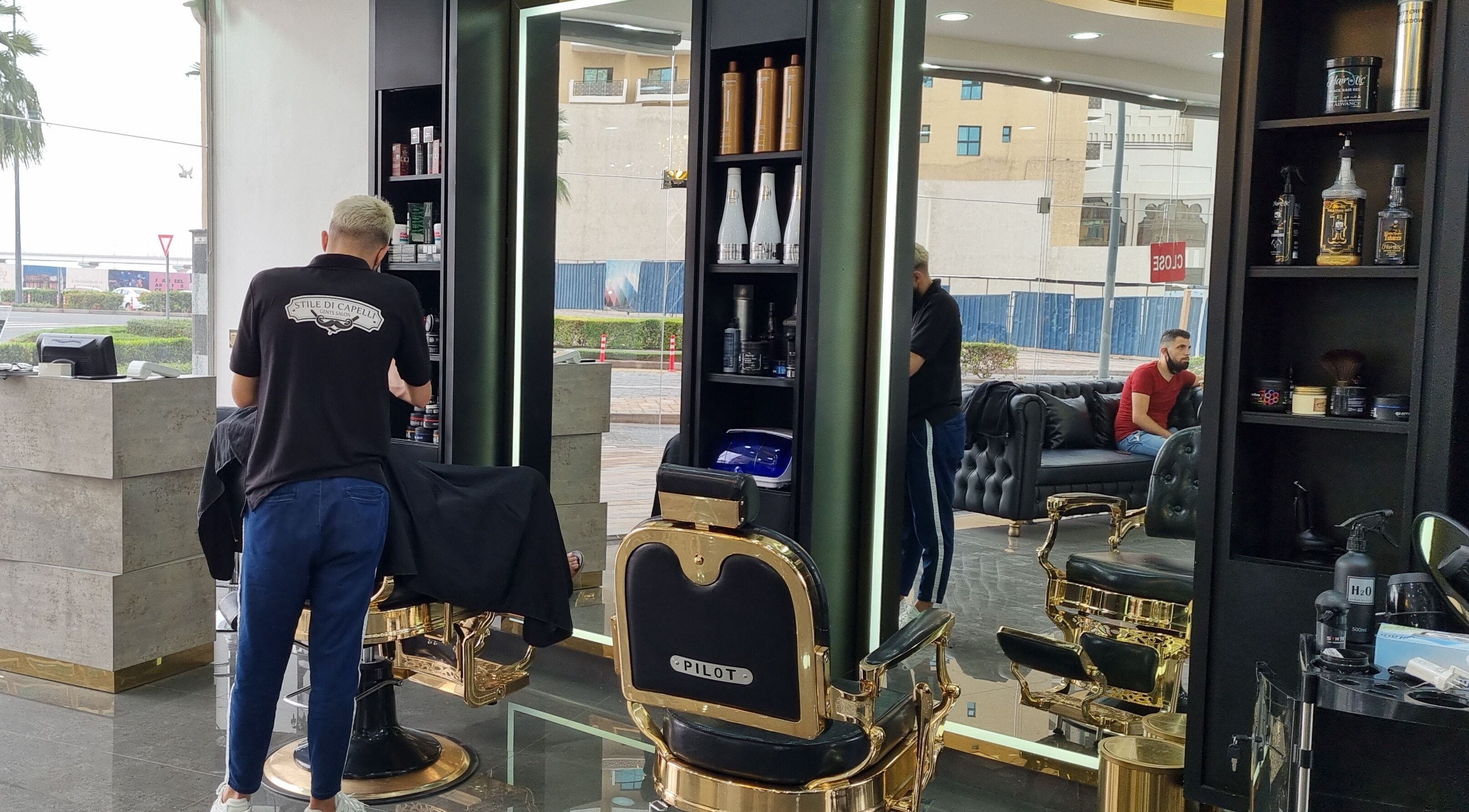 Interior of Stile Di Capelli Gents Salon in Dubai, Dubai, AE featuring grooming products and seating.