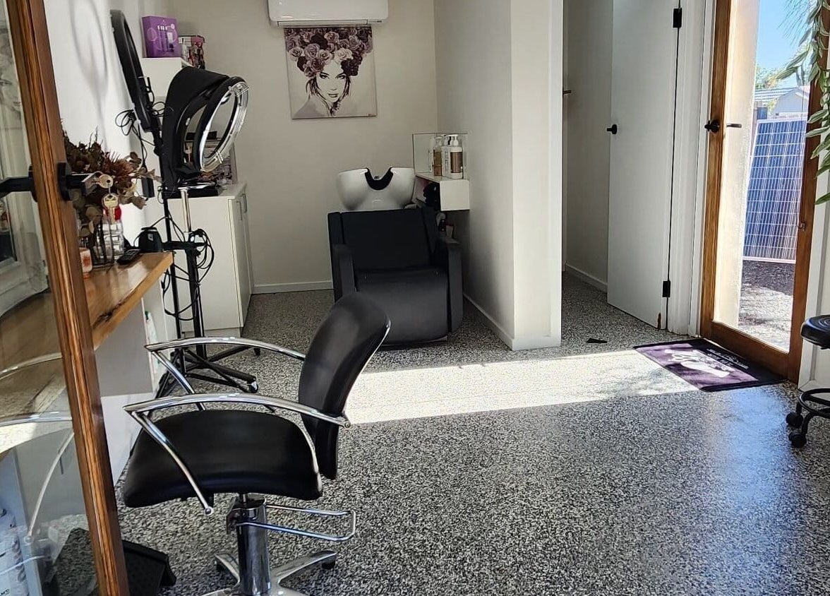 Ilva's stylish hairdressing station in Melbourne, Victoria, AU featuring sleek chairs and natural light.