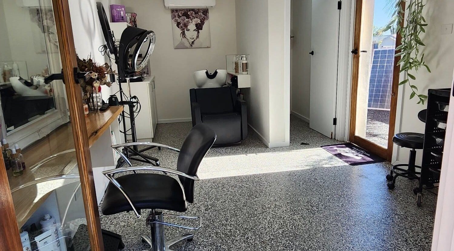 Ilva's stylish hairdressing station in Melbourne, Victoria, AU featuring sleek chairs and natural light.