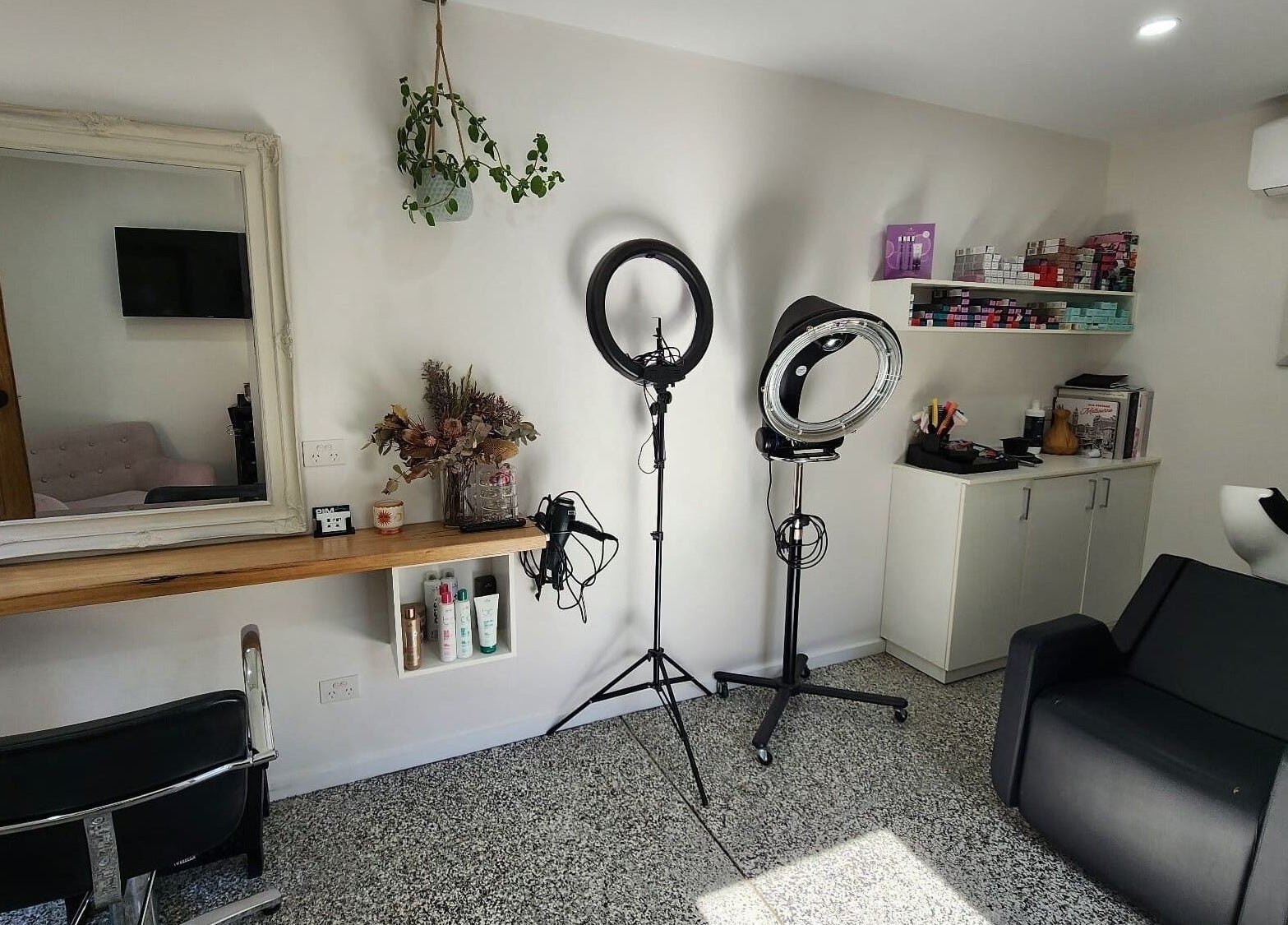 Sophisticated salon interior at Ilva, Melbourne, Victoria, AU, showcasing styling tools and elegant decor.