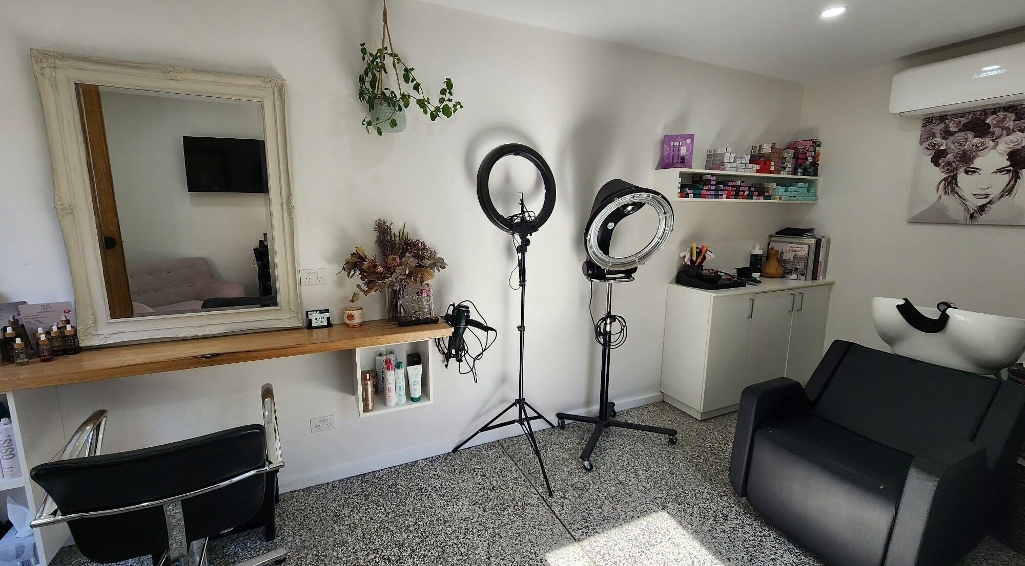 Sophisticated salon interior at Ilva, Melbourne, Victoria, AU, showcasing styling tools and elegant decor.