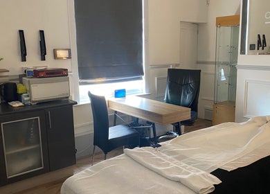 Bright therapy room at Kitson Care in Wolverhampton, England, GB with a cozy massage table and modern decor.