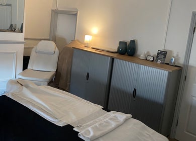 Cozy spa room at Kitson Care, Wolverhampton, England, GB with a white chair and soothing decor.