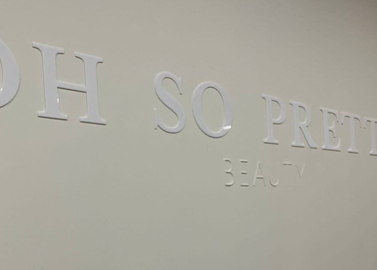 Oh So Pretty sign on the wall of Wigston beauty venue, England, GB