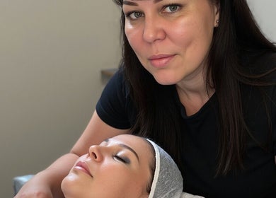 Facial treatment at Erene Beauty Studio, Bathgate, Scotland, GB, with beautician and relaxed client.