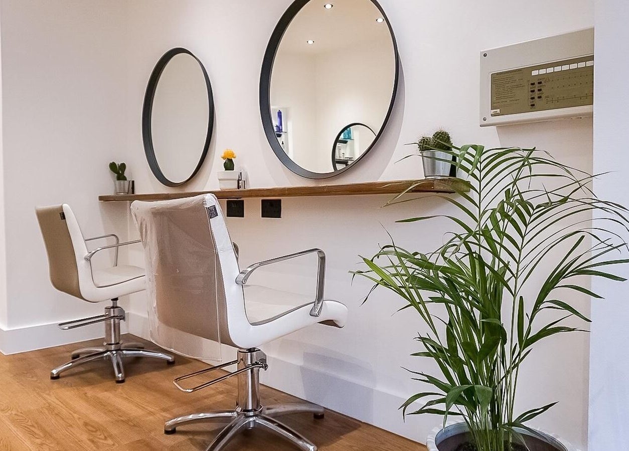 Stylish salon chairs and mirrors at Create Salon in Cardiff, Wales, GB, highlighting modern design.