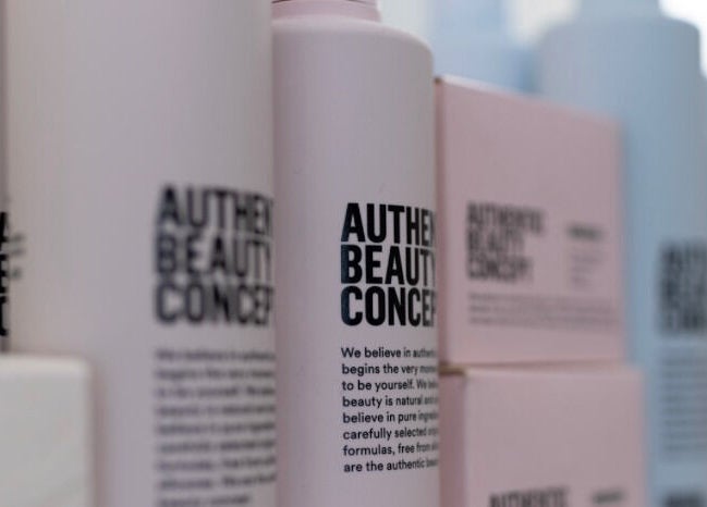 Create Salon in Cardiff, Wales, GB displays elegant beauty product bottles on a shelf.