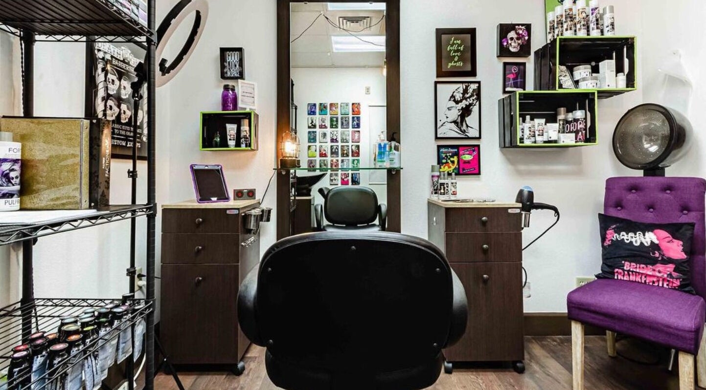 Interior of Villain Salon Studio showing styling stations and decor in Denver, Colorado, US.