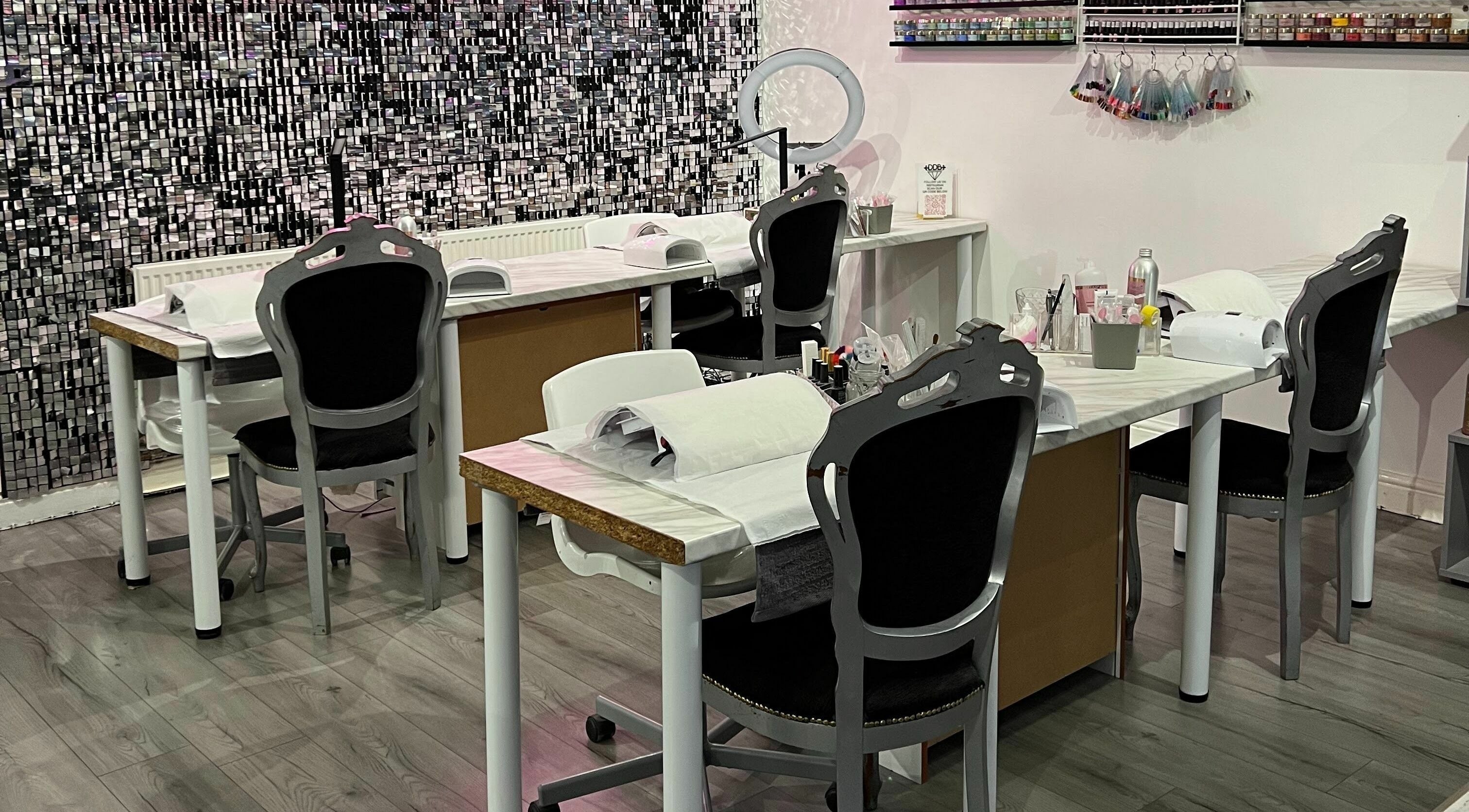Spacious and elegant nail stations at Diamond Dolls Beauty in Derby, England, GB, ready for clients.