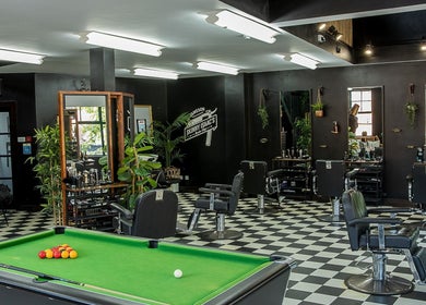 Interior of Skinny Isaac's Barber Shop & Hair System Studio in Belfast, Northern Ireland, GB with modern decor.