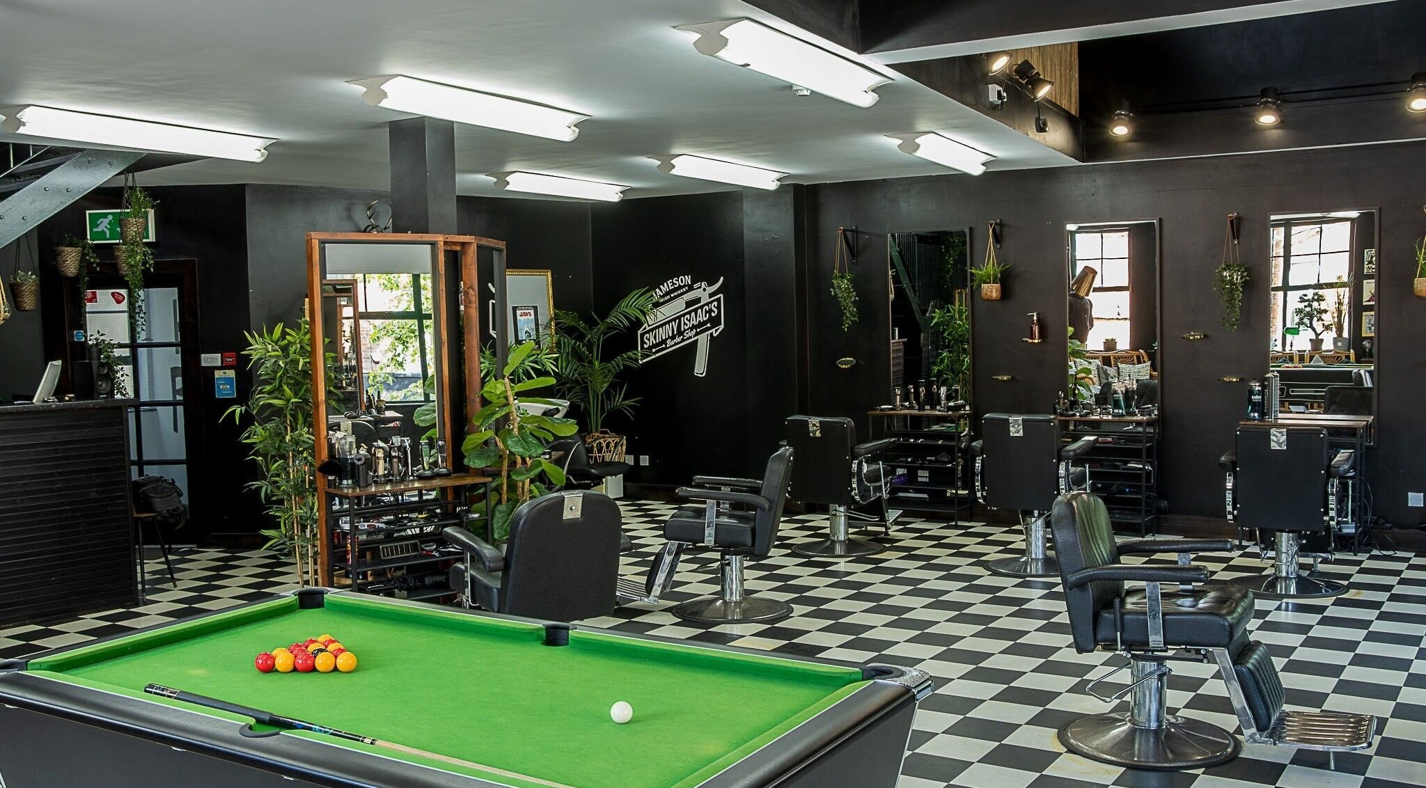 Interior of Skinny Isaac's Barber Shop & Hair System Studio in Belfast, Northern Ireland, GB with modern decor.