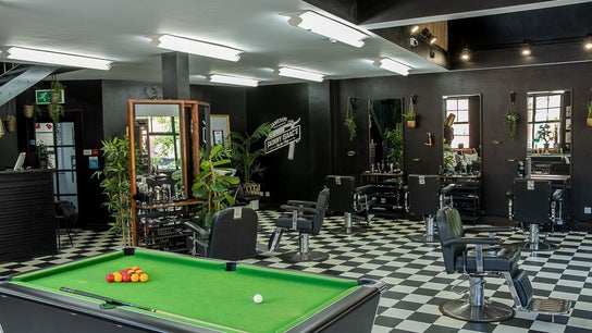 Skinny Isaac's Barber Shop & Hair System Studio