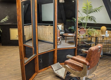 Elegant interior of Skinny Isaac's Barber Shop & Hair System Studio in Belfast, Northern Ireland, GB.