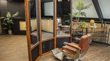 Elegant interior of Skinny Isaac's Barber Shop & Hair System Studio in Belfast, Northern Ireland, GB.