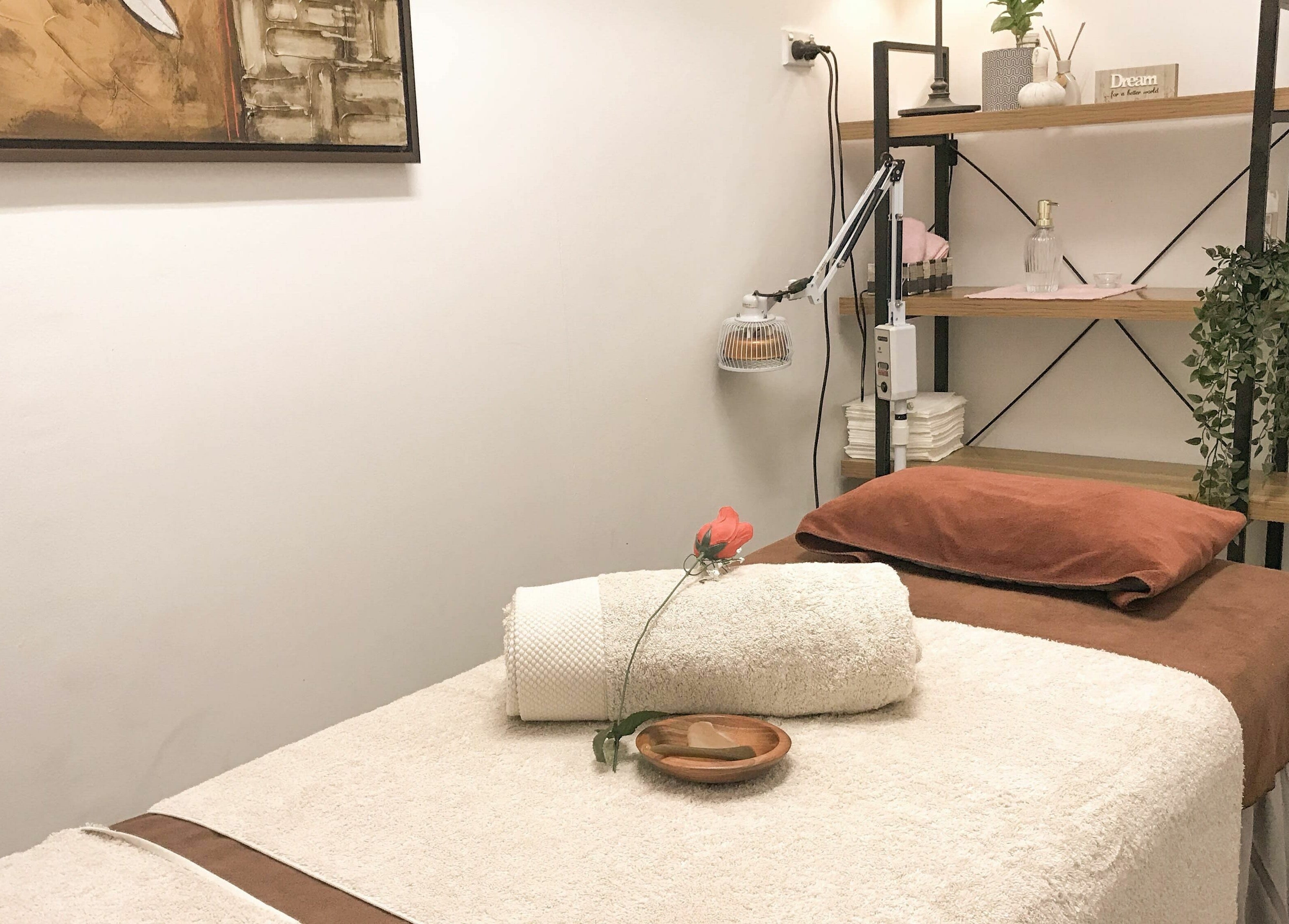 Relaxing treatment room at Kamiya Day Spa, Ashburton, Victoria, AU. Calming ambiance with towels and decor.