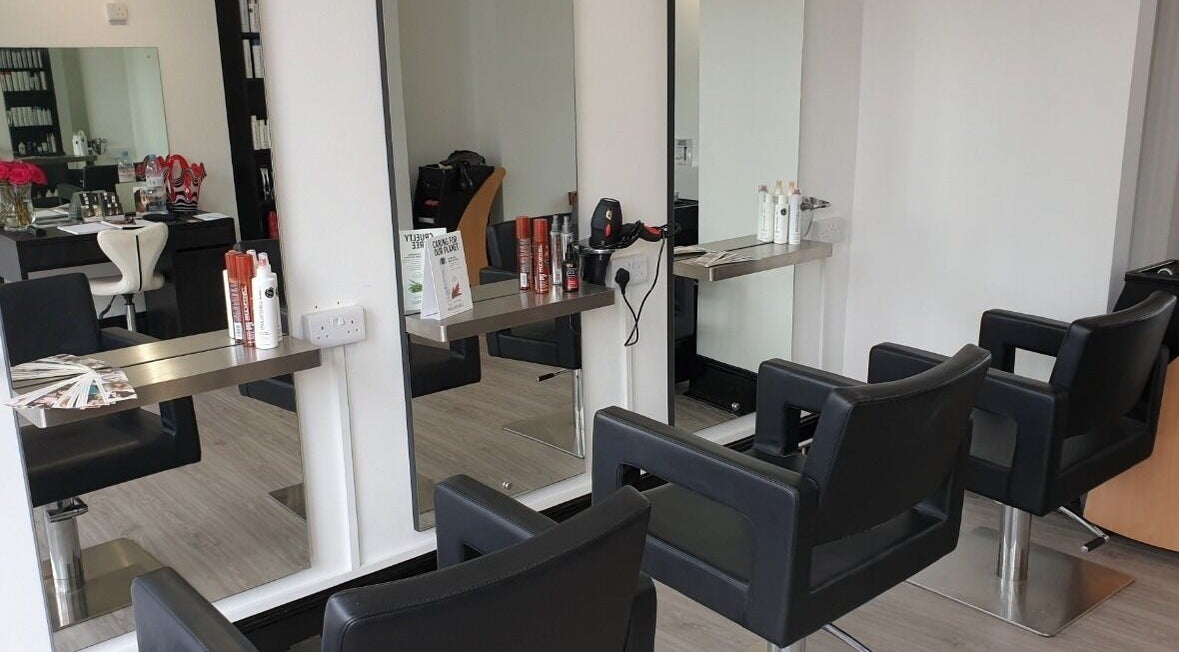 Modern salon chairs and styling stations at Anita Love Hair in Tunbridge Wells, England, GB.