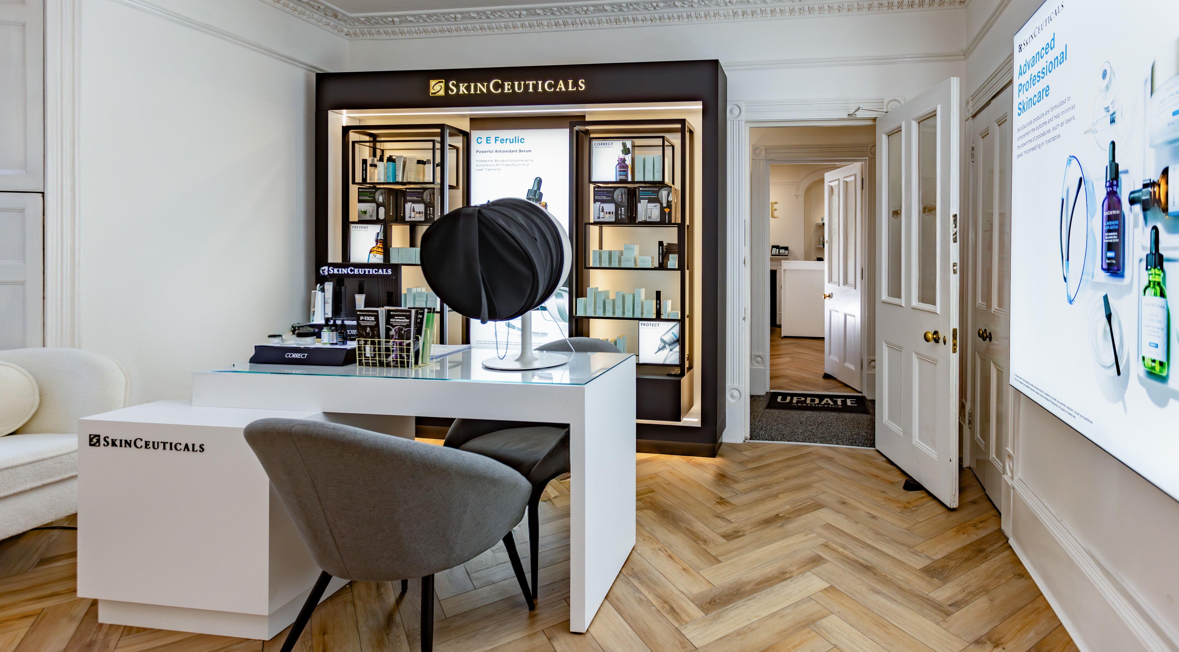 Modern interior of Update Aesthetics Lemon Street, Truro, England, GB, showcasing skincare products.