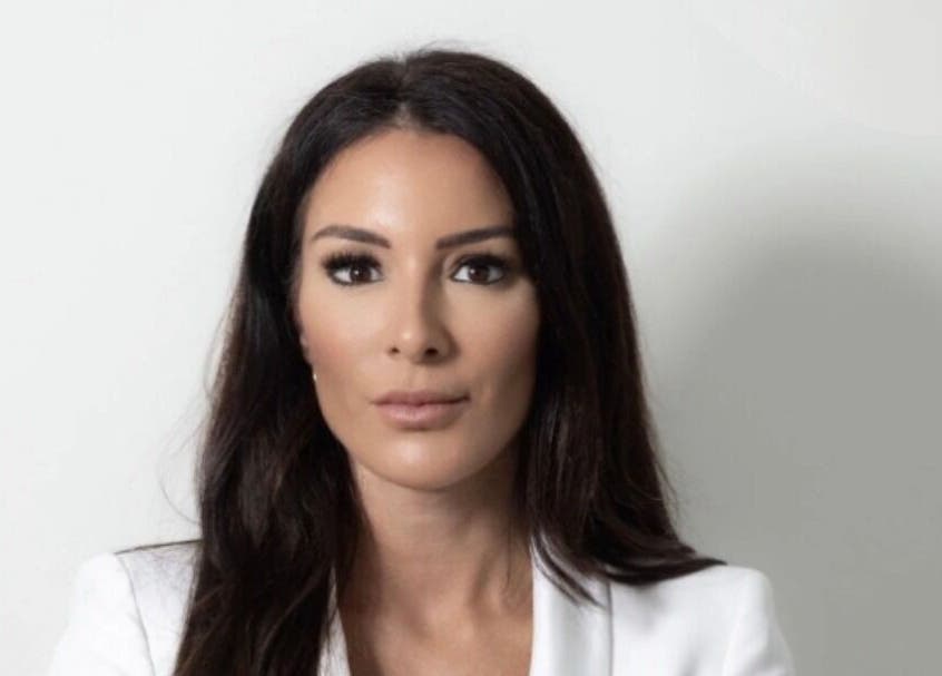 Professional woman at Bristol Clinic, Bristol, England, GB, showcasing elegance and confidence.