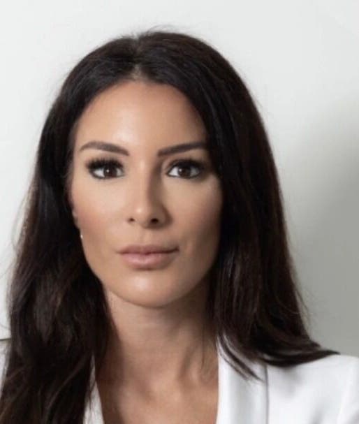 Professional woman at Bristol Clinic, Bristol, England, GB, showcasing elegance and confidence.