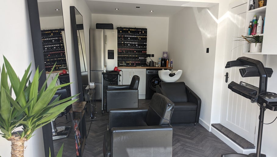 Elegant interior of The Salon in Bollington, United Kingdom, GB, showcasing sleek chairs and modern décor.