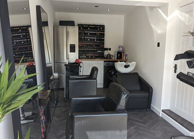 Elegant interior of The Salon in Bollington, United Kingdom, GB, showcasing sleek chairs and modern décor.