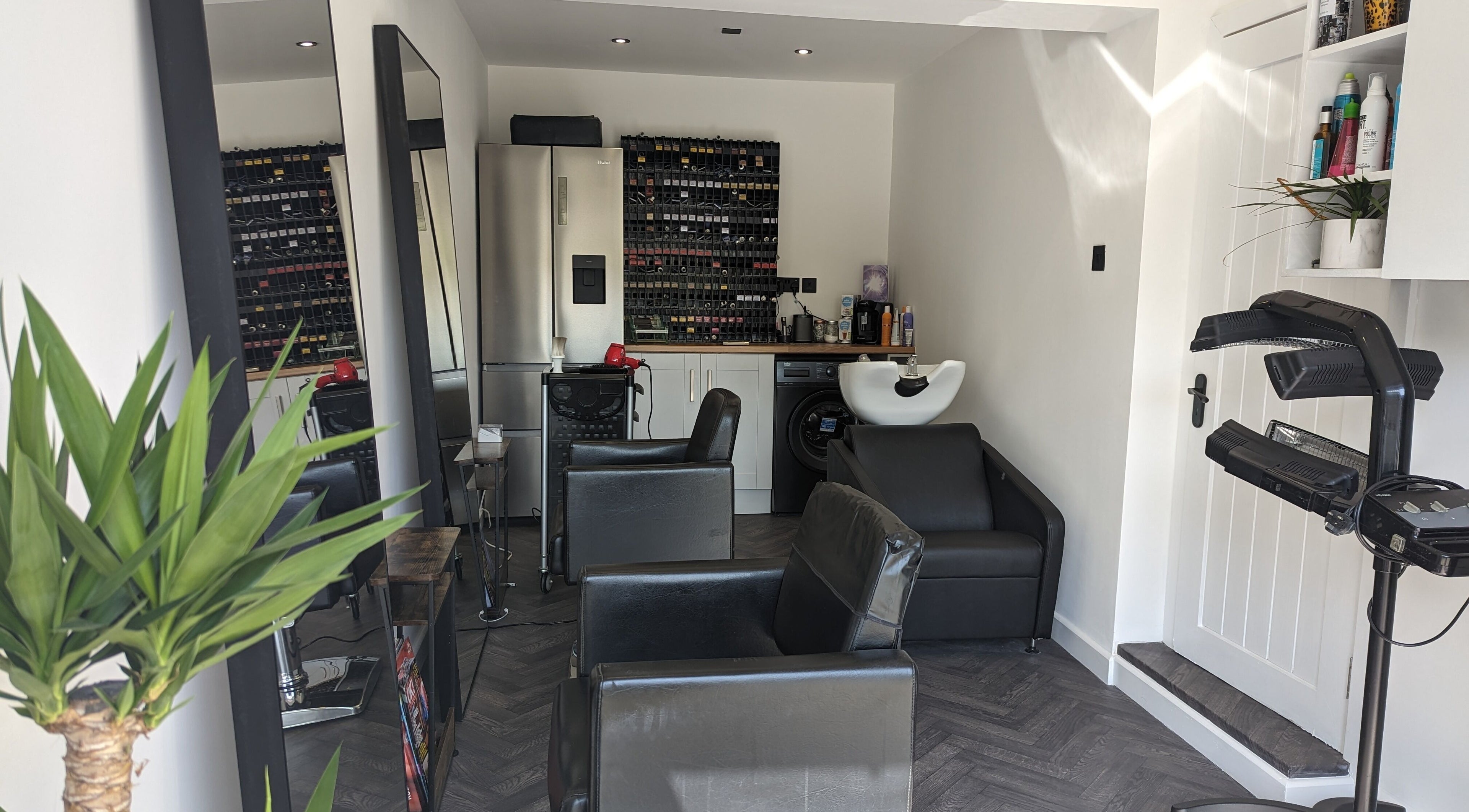 Elegant interior of The Salon in Bollington, United Kingdom, GB, showcasing sleek chairs and modern décor.