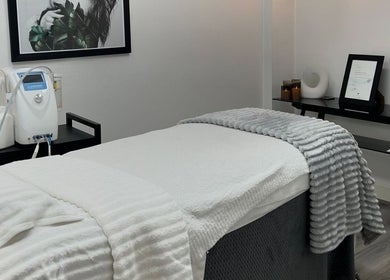 Relaxing treatment room at Vanish Laser & Skin, Melbourne, Victoria, AU, featuring a massage table and decor.
