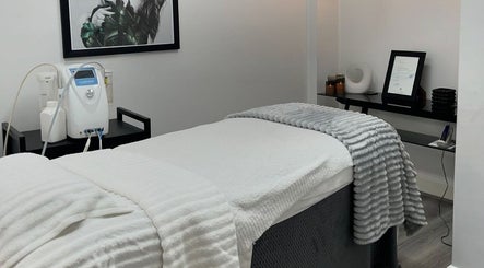 Relaxing treatment room at Vanish Laser & Skin, Melbourne, Victoria, AU, featuring a massage table and decor.