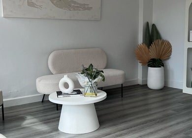 Chic lounge area at Vanish Laser & Skin in Melbourne, Victoria, AU with modern decor and cozy seating.