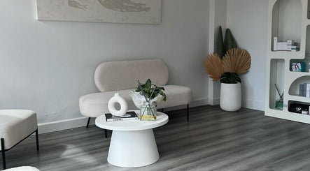 Chic lounge area at Vanish Laser & Skin in Melbourne, Victoria, AU with modern decor and cozy seating.