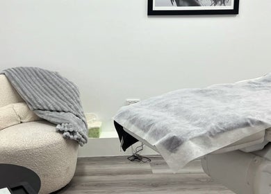 Comfortable treatment room at Vanish Laser & Skin, Melbourne, Victoria, AU. Features plush chair and treatment bed.