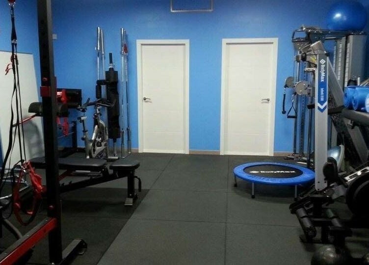 Modern gym setup at Activ Sports Medicine and Performance Clinic in Gibraltar, GI featuring state-of-the-art equipment.