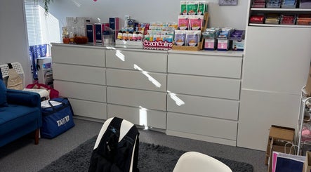 Bright wellness room at Coach Collins - The 1:1 Diet, Southampton, showcasing wellness products and seating area.