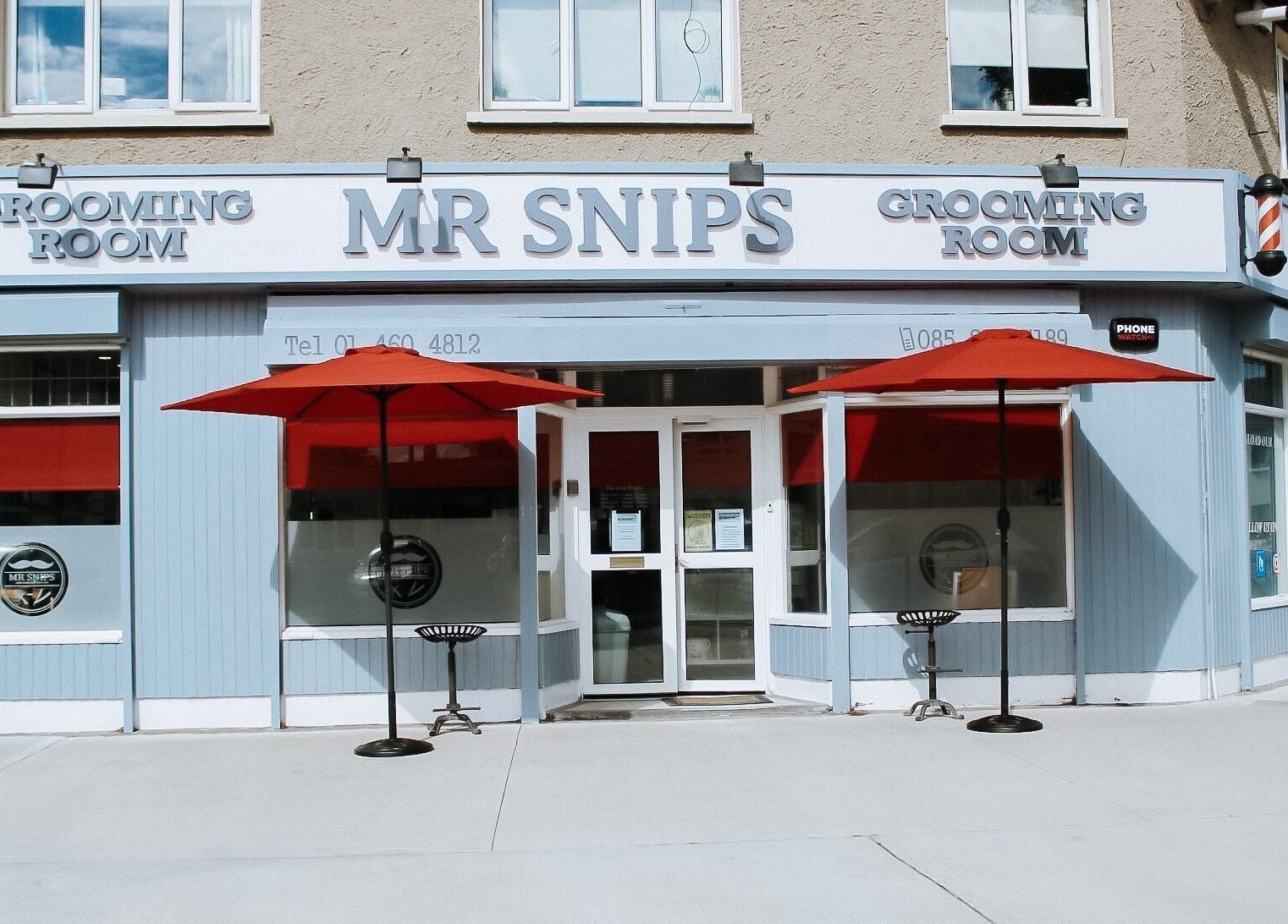 Exterior of Mrsnips salon with red canopies in Dublin, County Dublin, IE, showcasing a welcoming entrance.