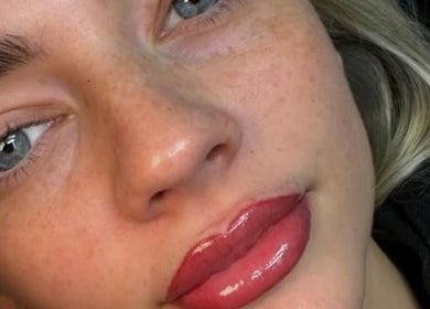 Close-up of glossy lips and flawless skin at Lovelli Lashes Brows and Training, Halfway, England, GB.
