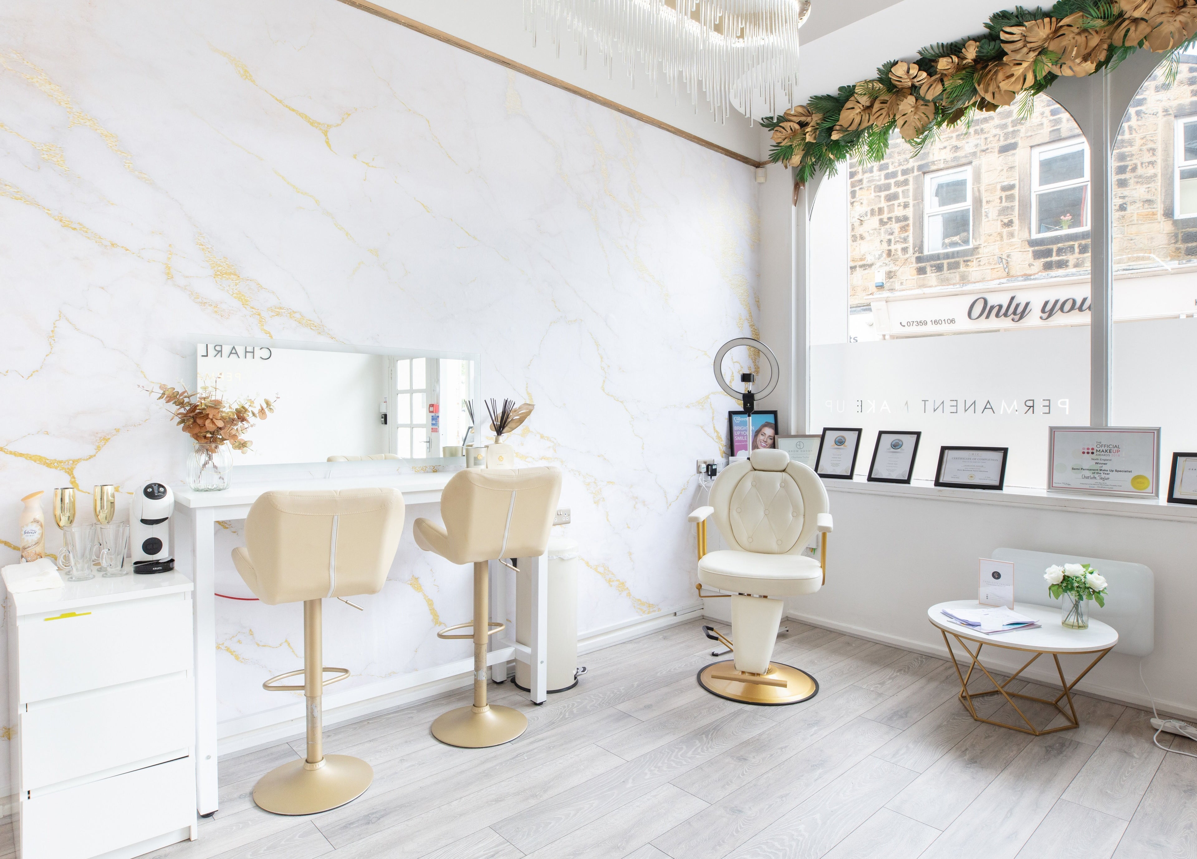 Interior of Charlotte Taylor Permanent Makeup Leeds Clinic in Yeadon, England, GB, showcasing modern makeup station.