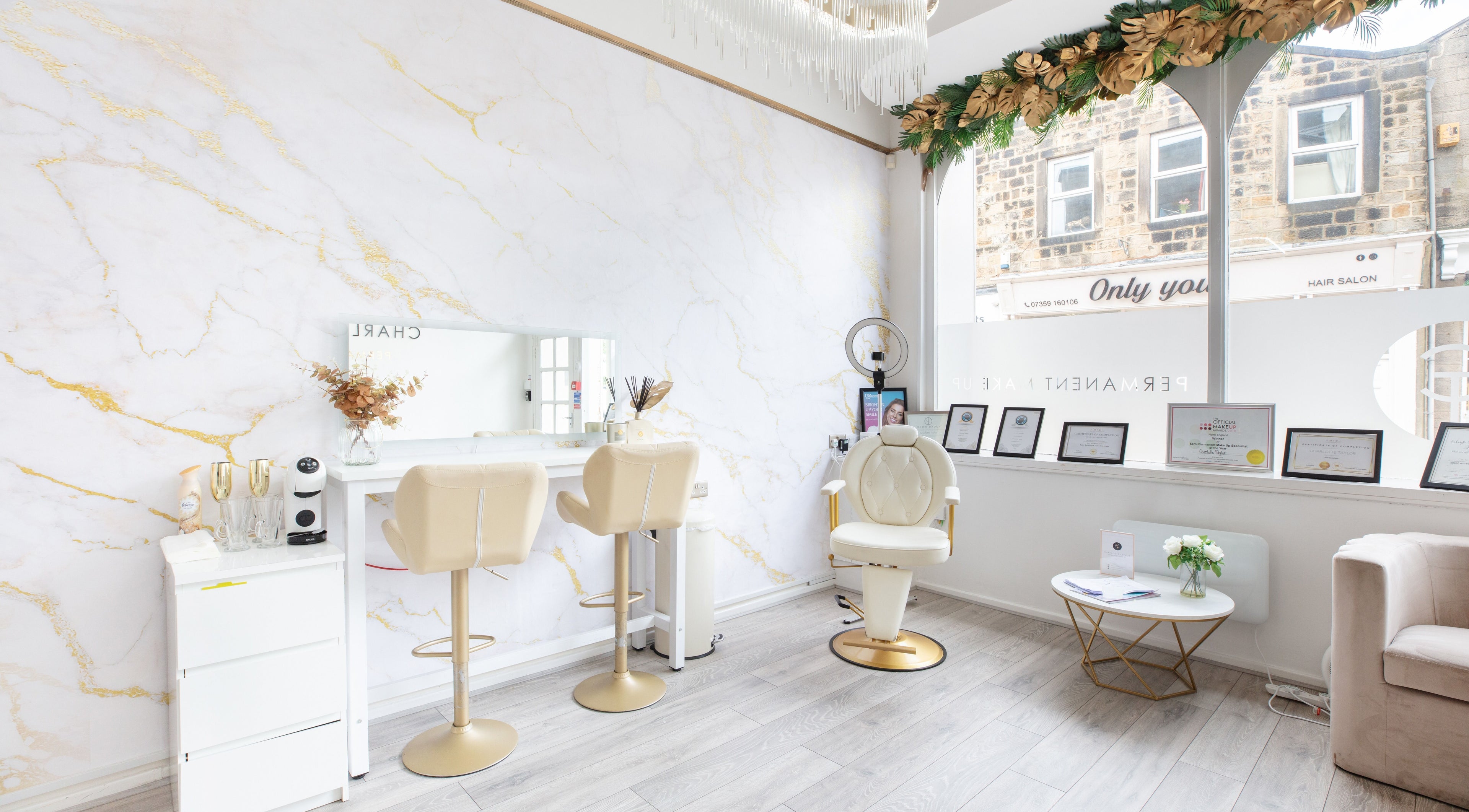 Interior of Charlotte Taylor Permanent Makeup Leeds Clinic in Yeadon, England, GB, showcasing modern makeup station.