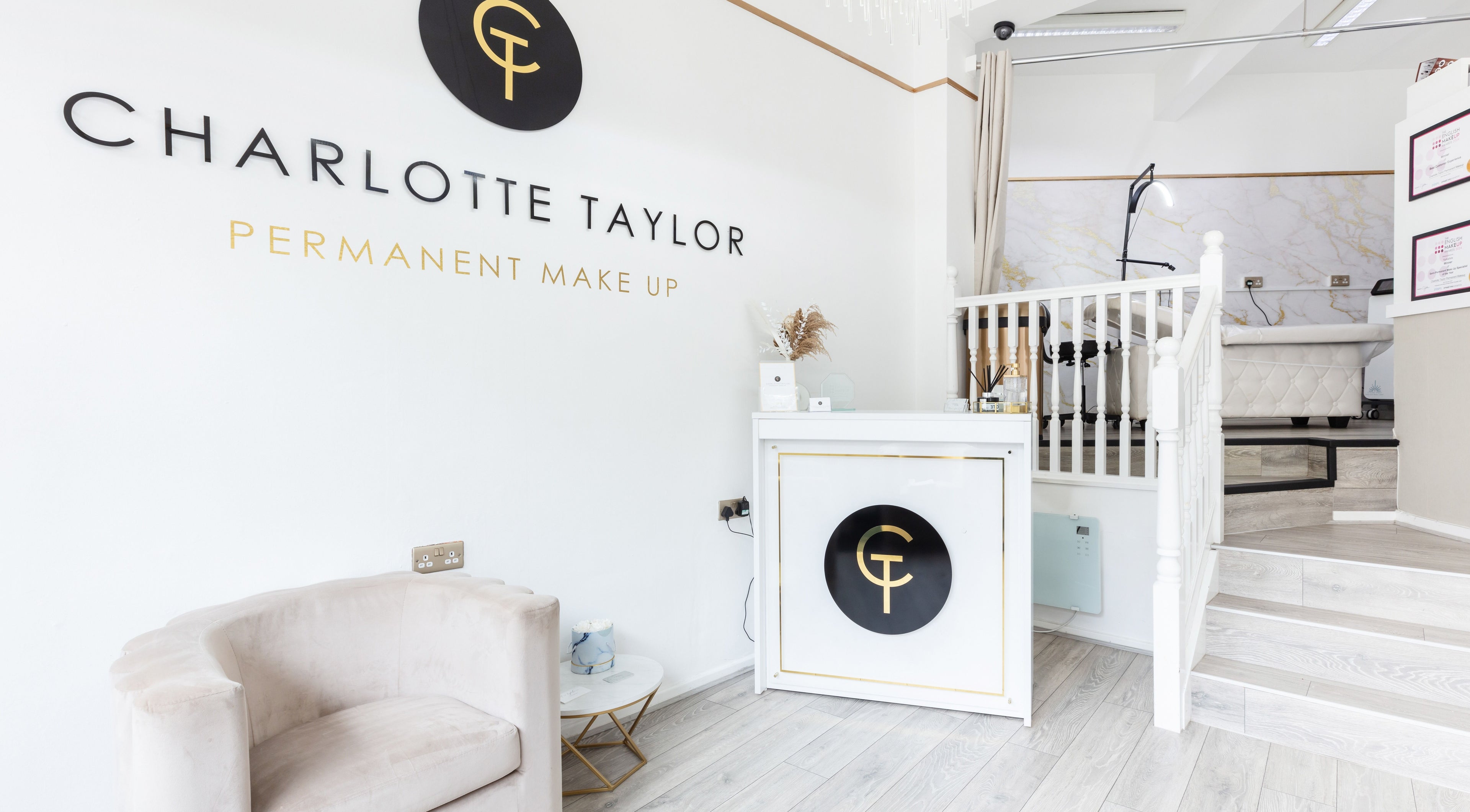 Reception at Charlotte Taylor Permanent Makeup Leeds Clinic in Yeadon, England, GB featuring modern white decor.