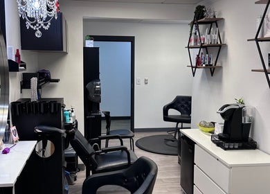 Chic interior of Shagan Hair salon in Mesa, Arizona, US with stylish chairs and products displayed.