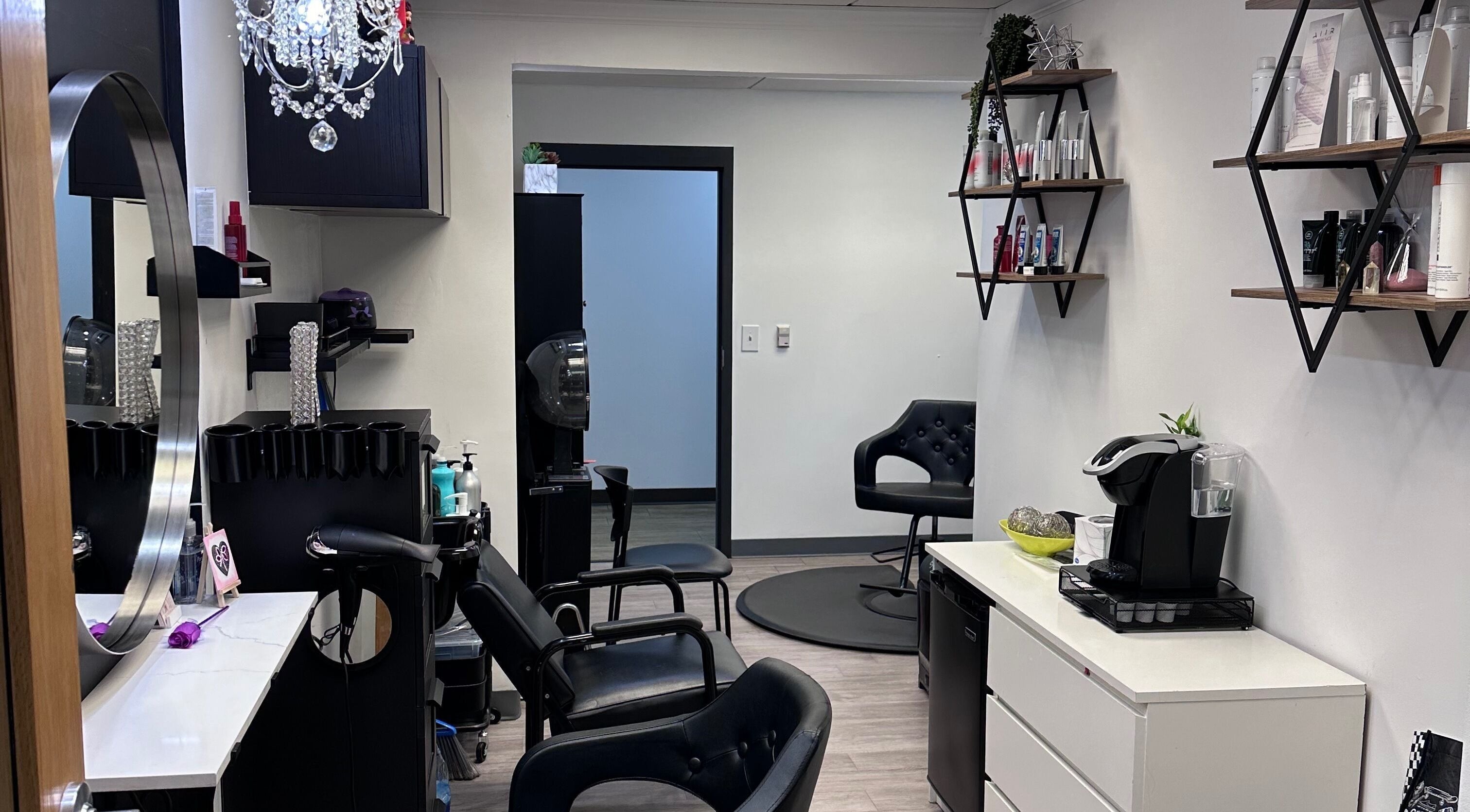 Chic interior of Shagan Hair salon in Mesa, Arizona, US with stylish chairs and products displayed.