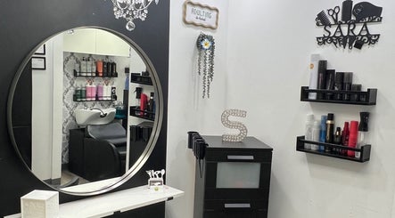 Elegant interior of Shagan Hair salon in Mesa, Arizona, US showcasing styling products and a chic mirror.