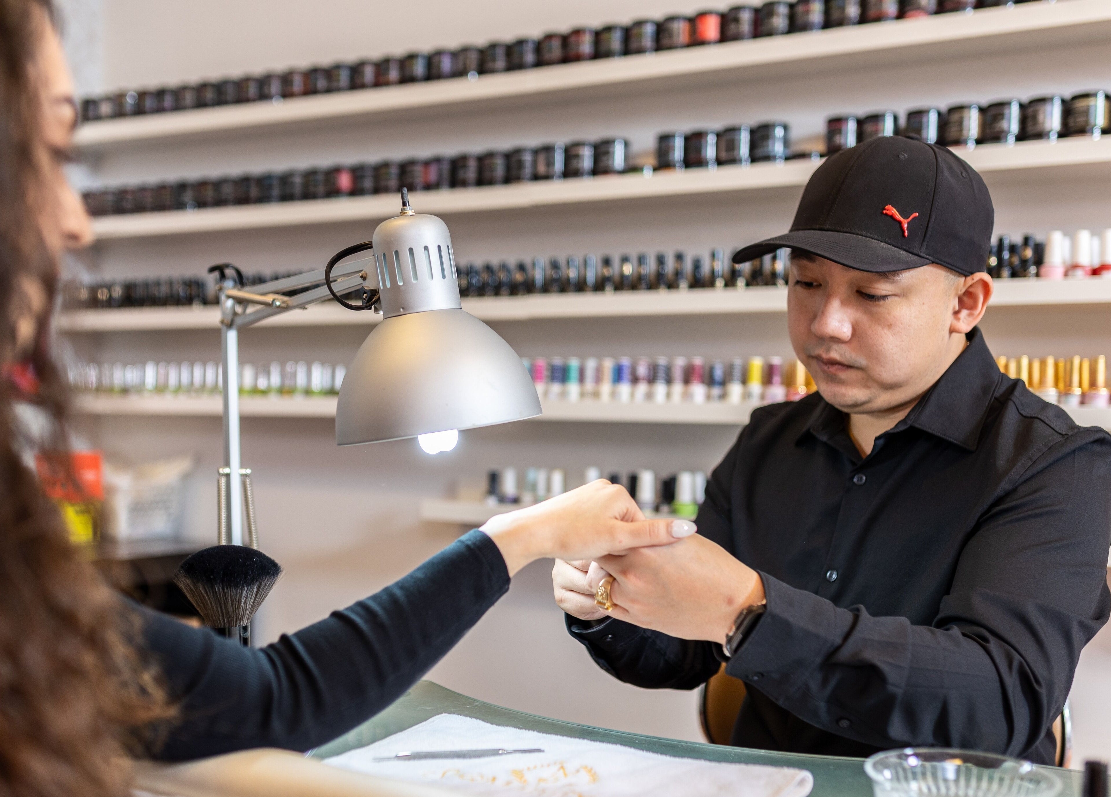 Nail technician at Spa ManiPedi providing manicure service in Côte Saint-Luc, Québec, CA.