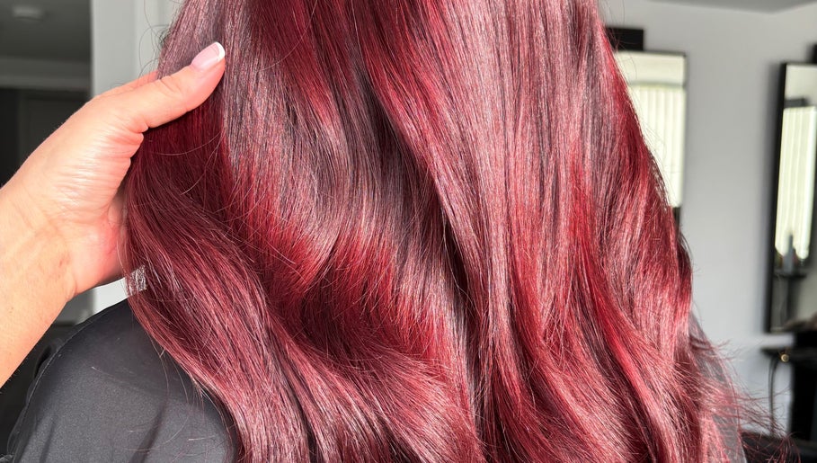 Rich crimson hair styled at Ashleah Marie Hairdressing in Stirling, Scotland, GB.