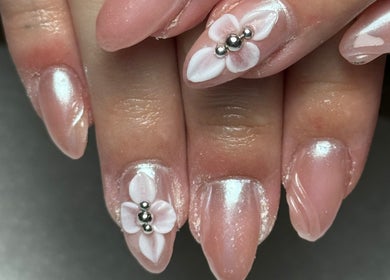 Elegant floral nail art at Agi’s Nails in Thurso, Scotland, GB showcases delicate flower design.