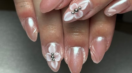 Elegant floral nail art at Agi’s Nails in Thurso, Scotland, GB showcases delicate flower design.