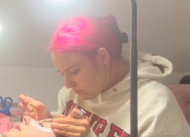 A technician applies eyelash extensions at Agi’s Nails, Thurso, Scotland, GB, highlighting precision and care.