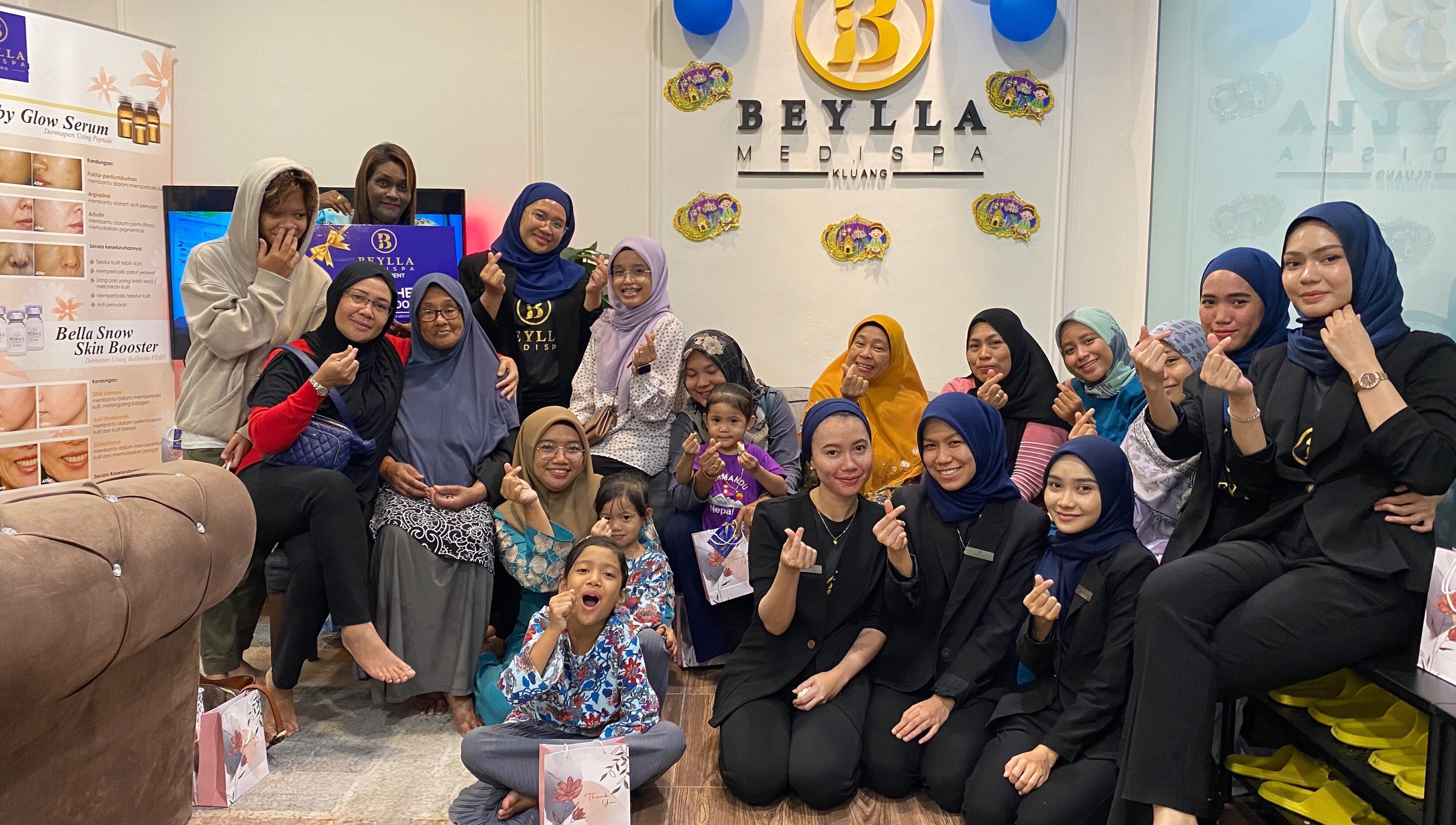 Group enjoying a joyful moment at Beylla Medispa Kluang in Kluang, Johor, MY, showcasing a vibrant atmosphere.