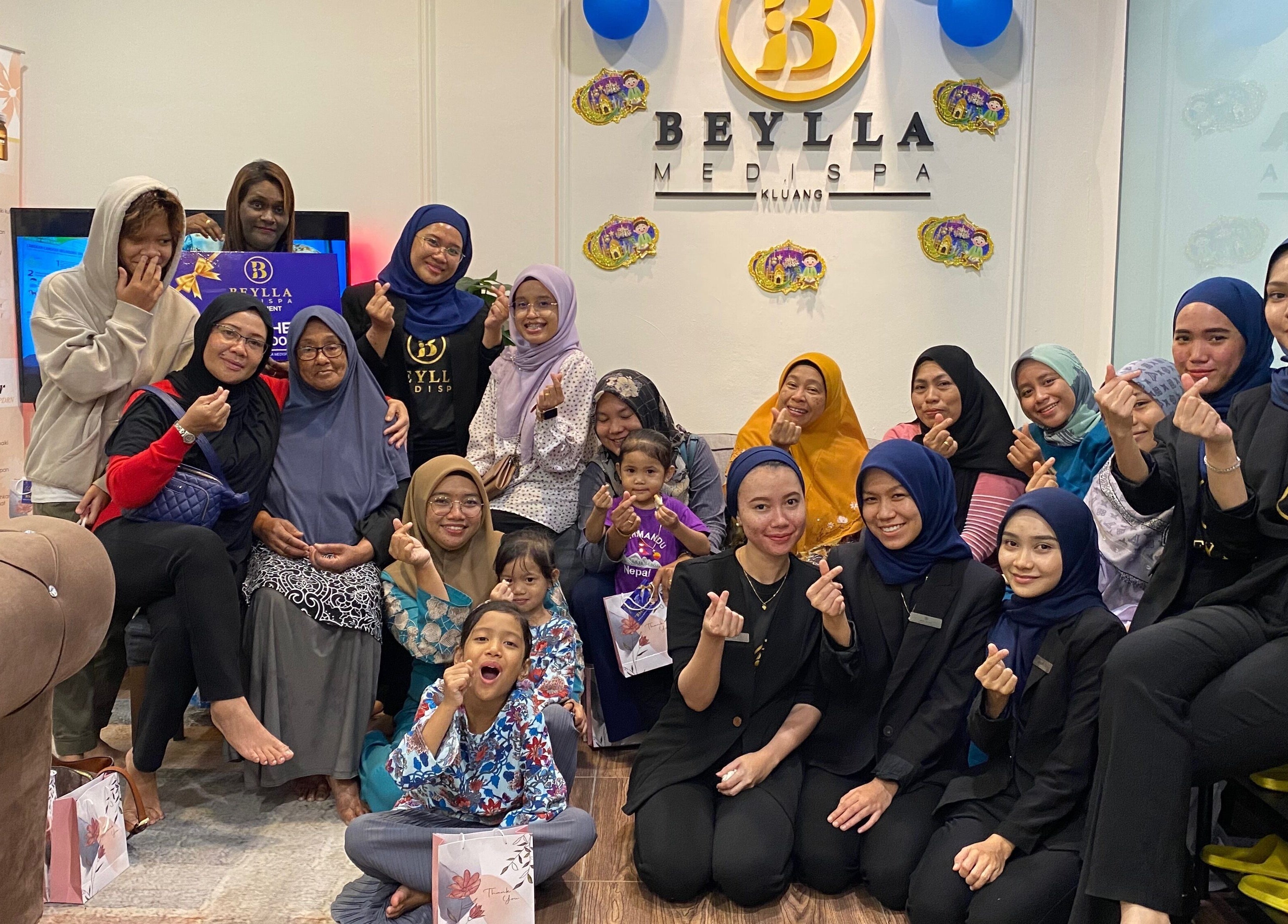 Group enjoying a joyful moment at Beylla Medispa Kluang in Kluang, Johor, MY, showcasing a vibrant atmosphere.